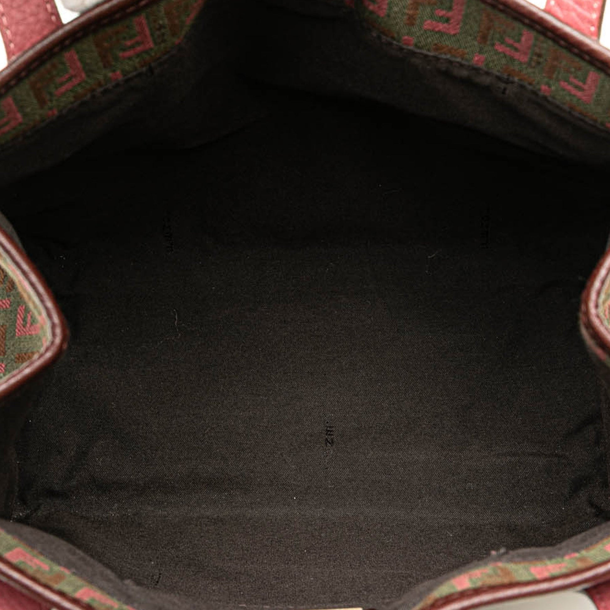 Interior view of the Fendi tote bag showing black fabric lining and partial FF monogram trim.