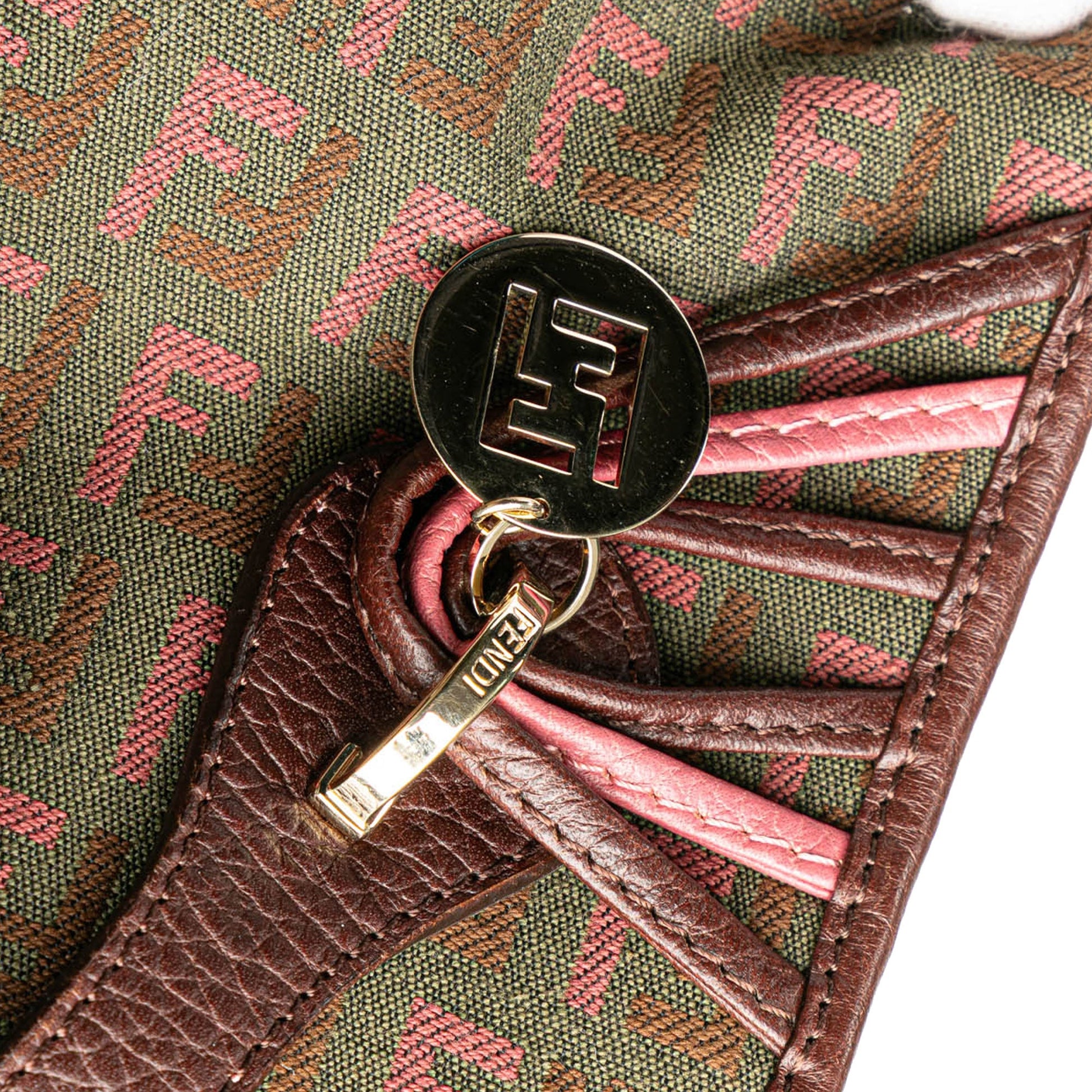 Detail of FF monogram canvas at bag opening with visible stitching and trim.